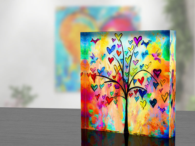 Euphoric blend of hearts in flight and celestial imagery on a luminous acrylic block, ideal for adding a touch of whimsy to any space.