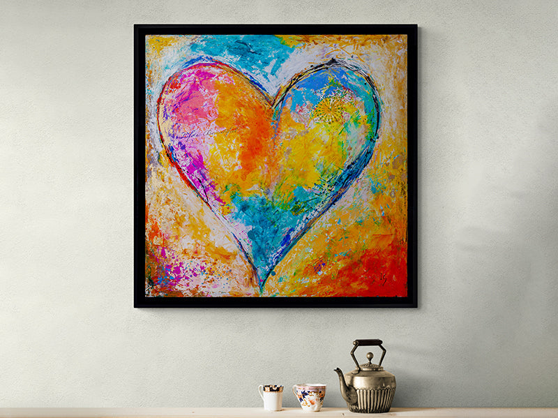 Ivan Guaderrama's 'Love is Beautiful' artwork, a heart in bold hues against a cool blue background, encapsulating vibrant love.