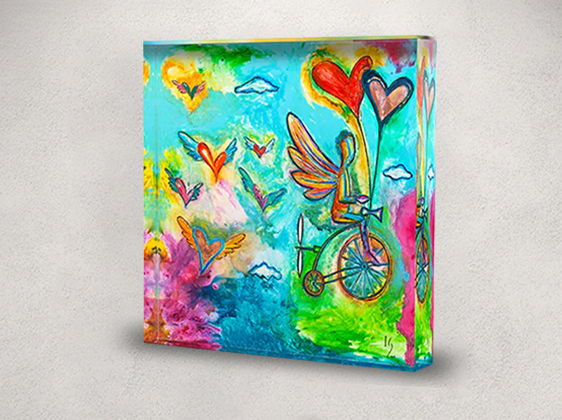 Euphoric blend of hearts in flight and celestial imagery on a luminous acrylic block, ideal for adding a touch of whimsy to any space.