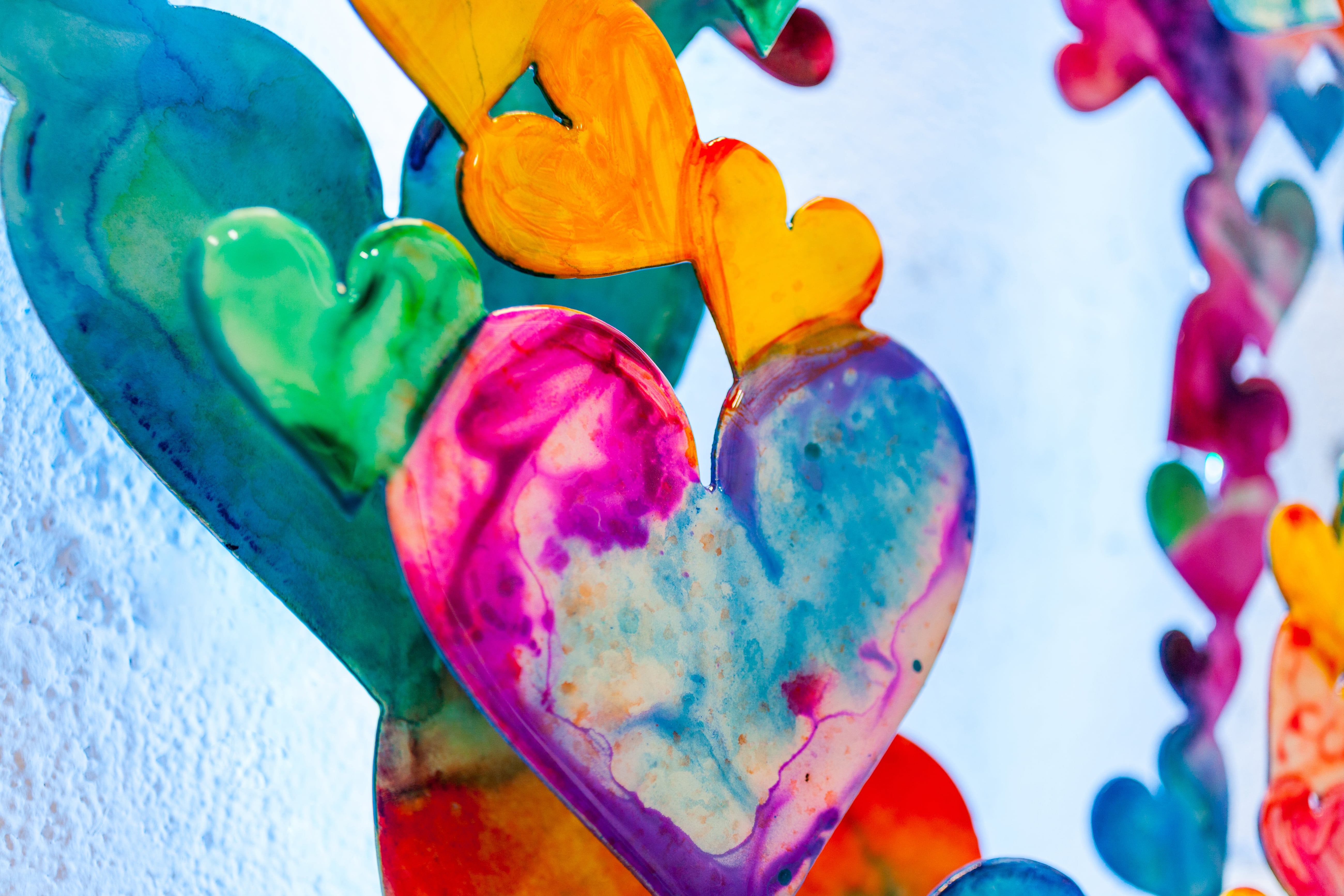 INFINITE LOVE canvas print in room setting - heart painting by Ivan Guaderrama